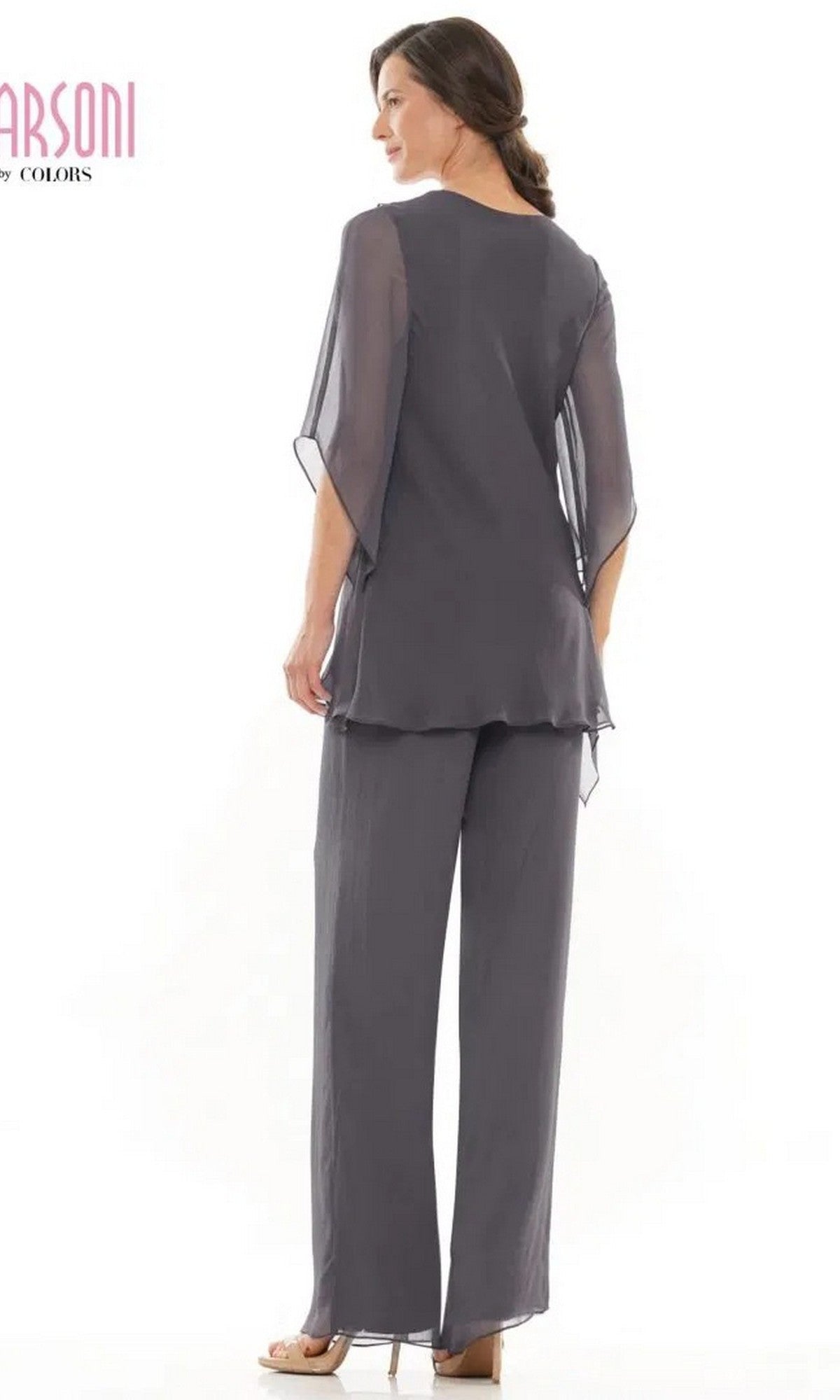 A woman is seen from the back wearing the Long Formal Pantsuit: Marsoni M308, a loose-fitting dark gray chiffon ensemble with sheer sleeves and matching wide-leg pants, posing against a white background.